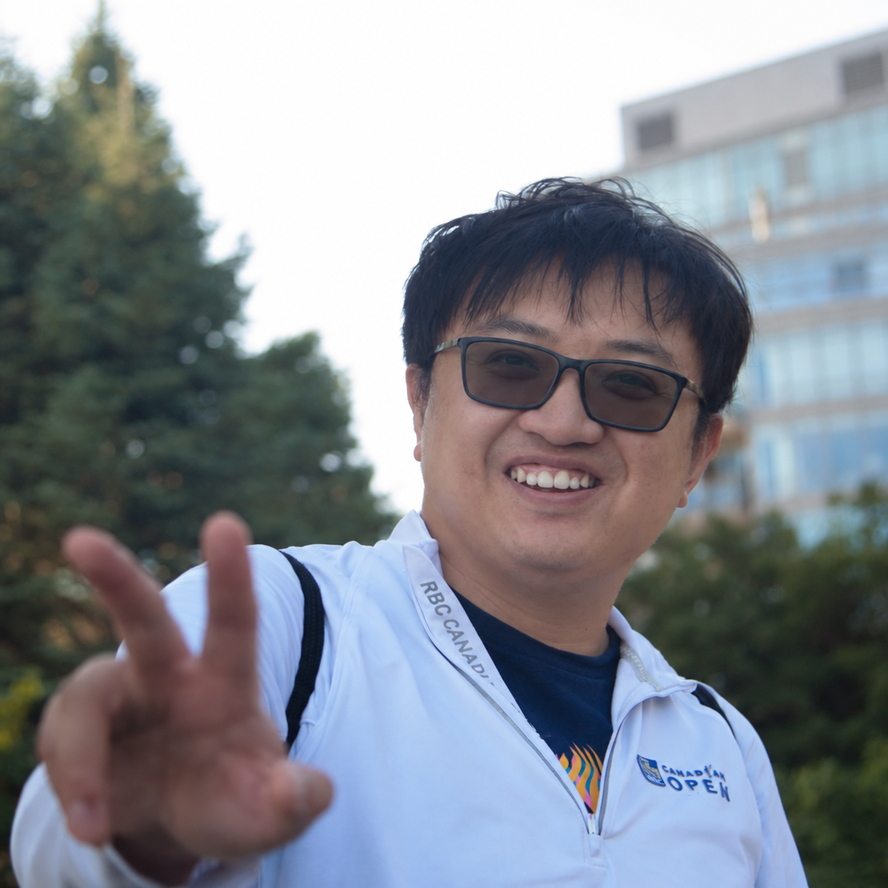 Michael Li smiling outdoors at the RBC Canadian Open